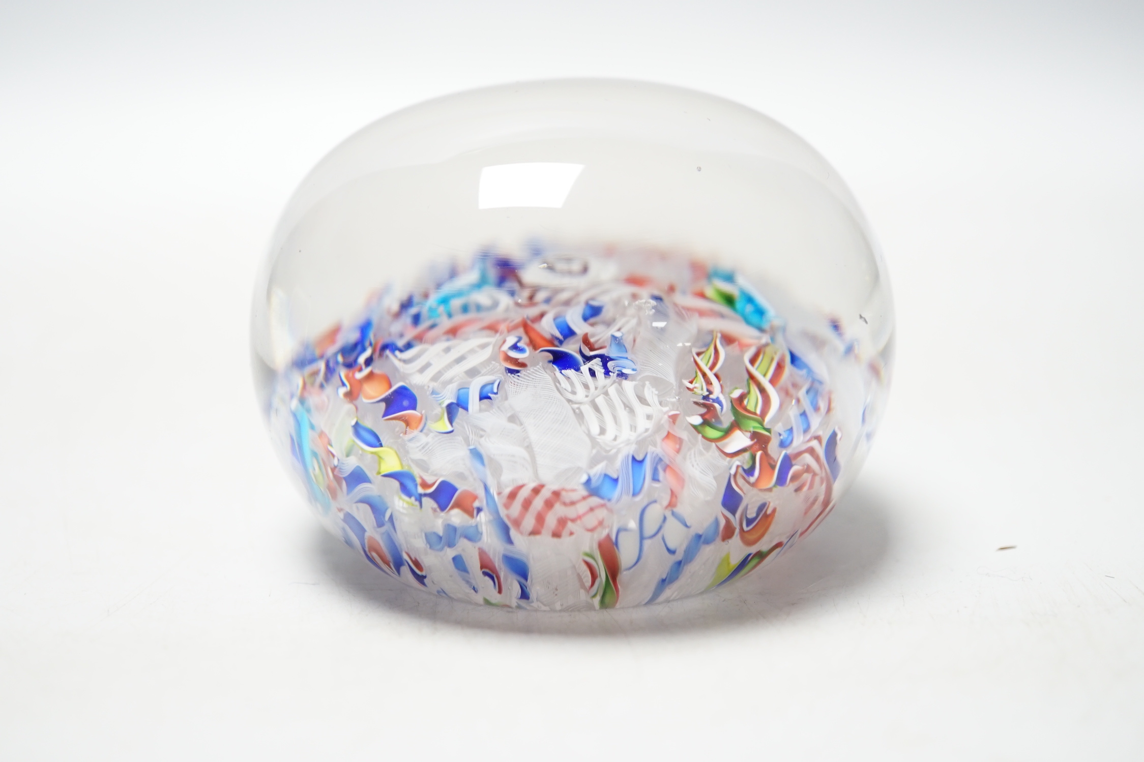 A St Louis paperweight with dog silhouette amid scrambled canes, 8cm diameter